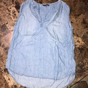 sleeveless light blue tee shirt. denim material